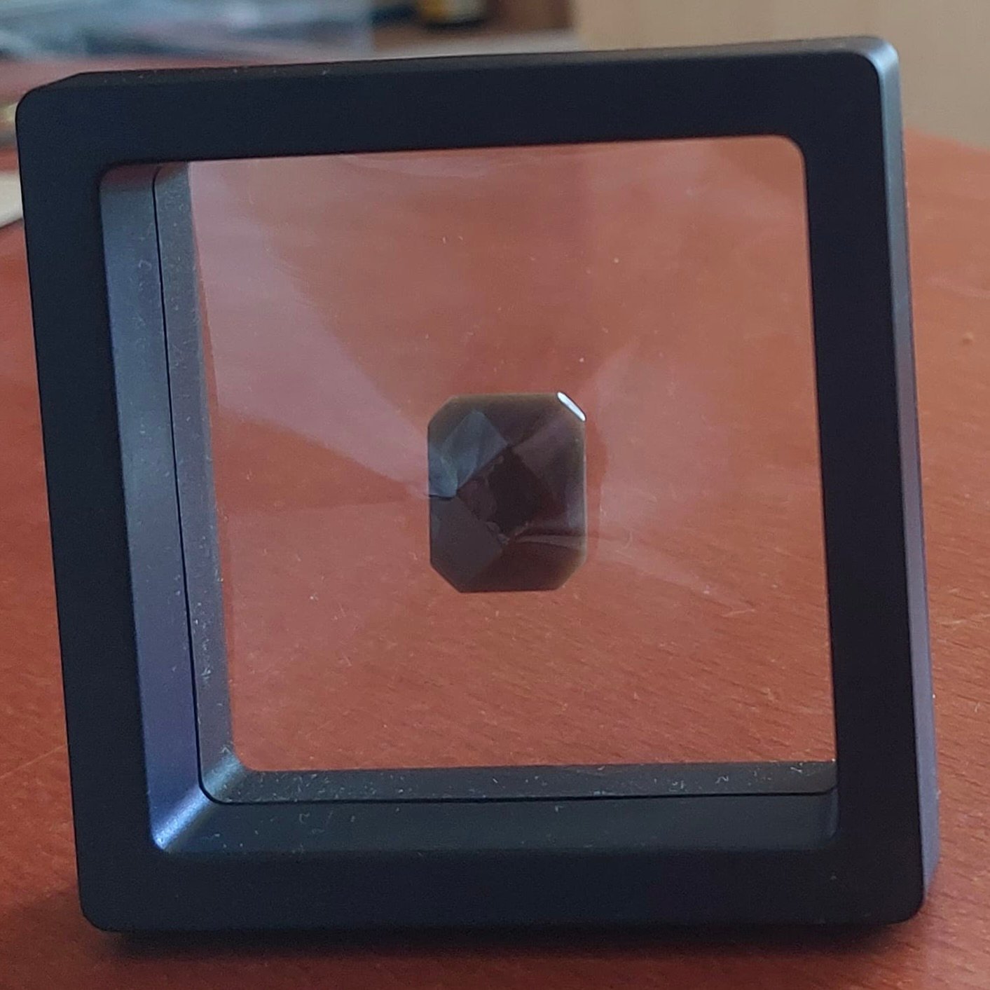 Bless-Stone displayed in a clear box — example photo